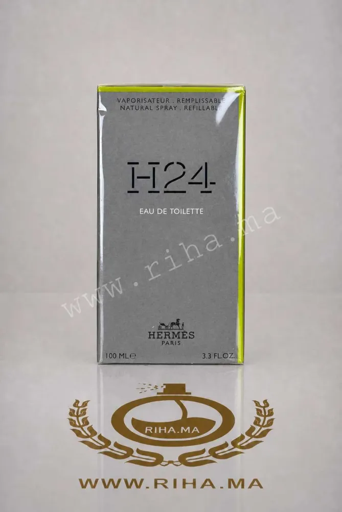 H24 Hermès Eau de Toilette pour homme 100ml h24 hermes — Flacon de parfum H24 Hermès posé sur fond vert élégant