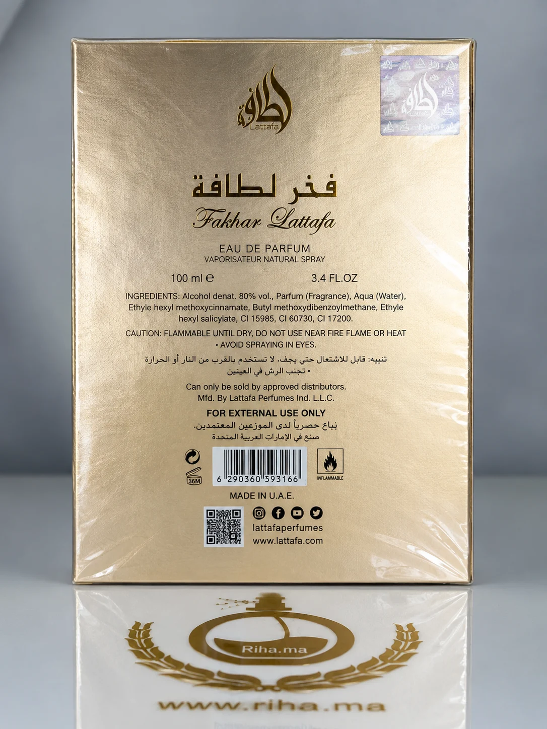 Fakhar Extrait Lattafa Perfumes Eau De Parfum pour homme 100ml — photo 2 Flacon de parfum Fakhar de Lattafa posé sur fond doré — vue 2