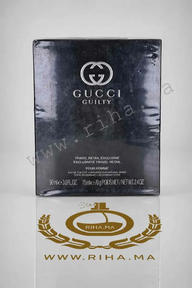 COFFRET GUCCI GUILTY TRAVEL RETAIL EXCLUSIVE EAU DE TOILETTE Coffret Gucci Guilty Travel Retail Exclusive posé sur fond élégant